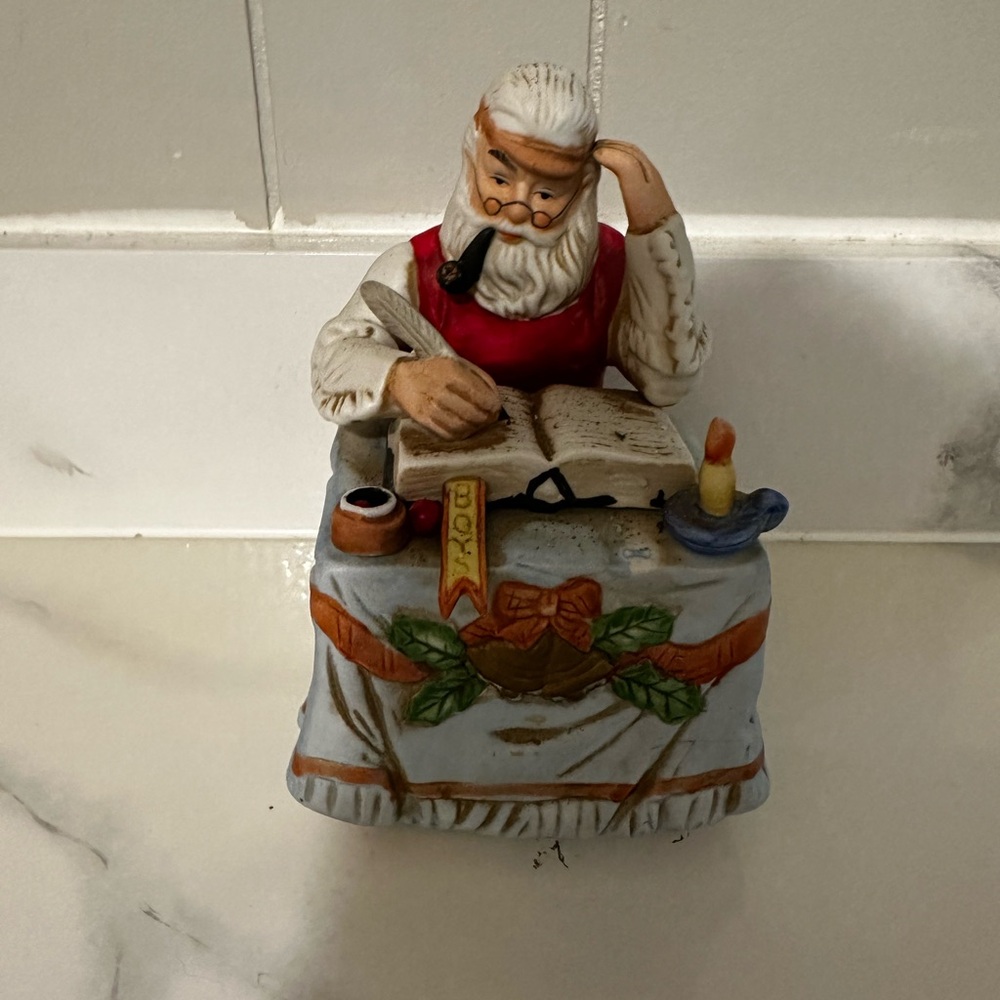 Santa Claus Figurine with Book and Candle